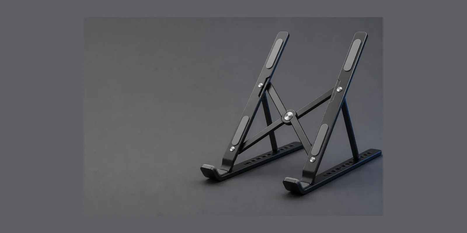 Folding laptop stand, matte black, on graphite